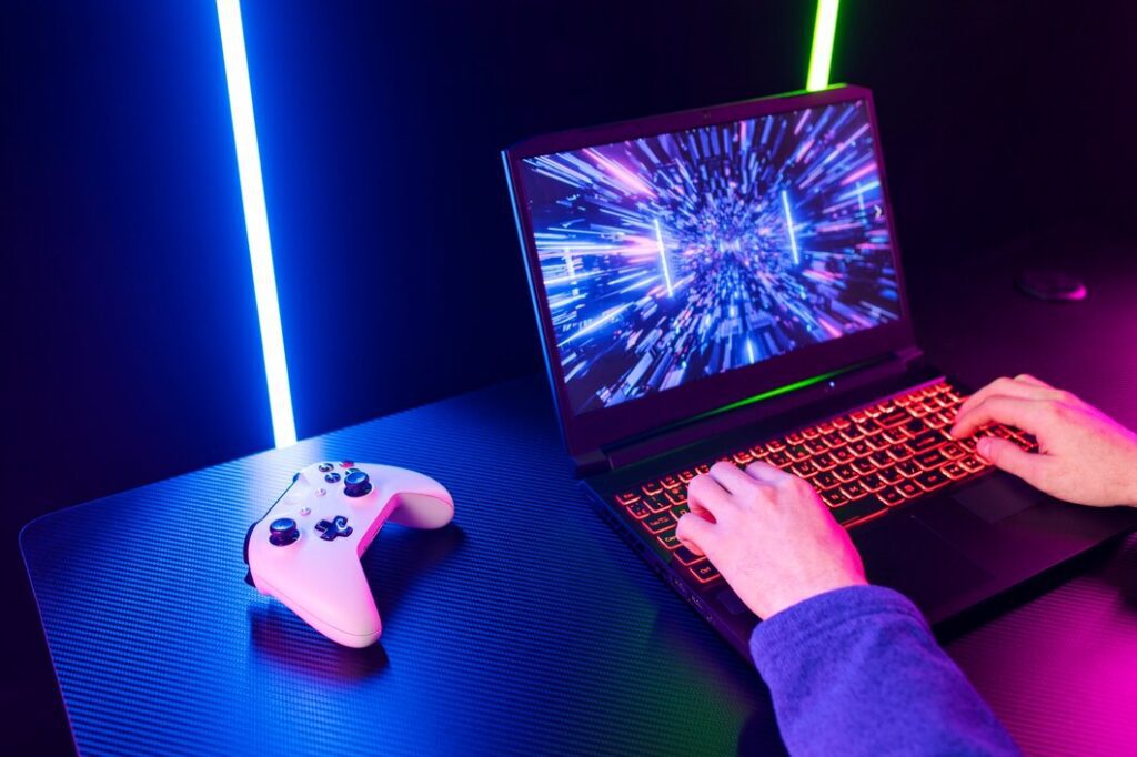 high angle gamer playing laptop 23 2149829167